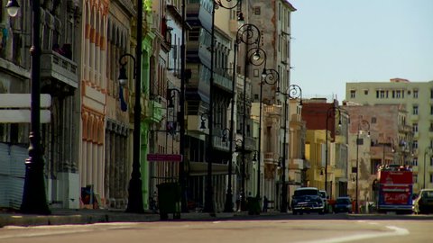 Havana, Cuba - CIRCA December 2009: View of busy road with cars circulating; various buildings in the background.