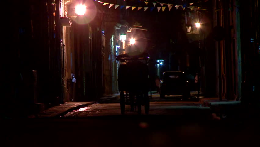 Havana, Cuba - CIRCA December 2009: Dark alley, narrow street with local circulation. 