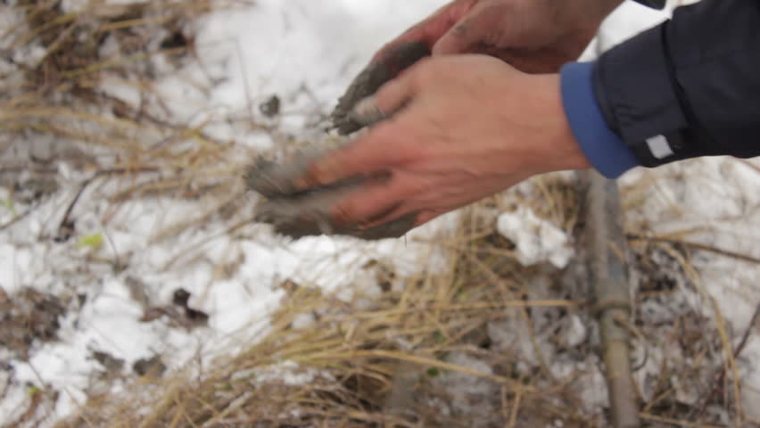 Worker produces the Geology of the soil. Worker produces drilling to test soil before installing the base.