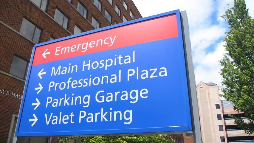 Establishing shot of sign at hospital that reads Main Hospital and Emergency.