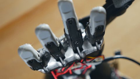 Bionic arm. Innovative robotic hand made on 3D printer. Futuristic technology. Timelapse.