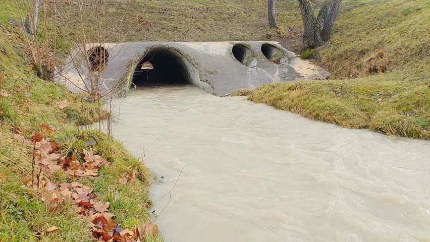 Small stream running under a bridge