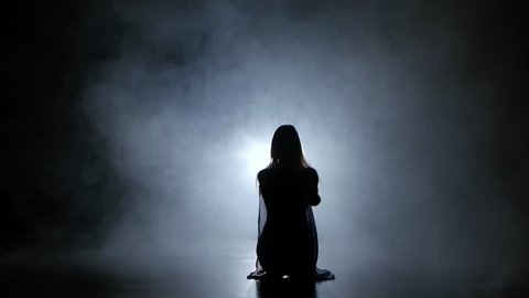 PJ girl dancer in studio with smoke against black background