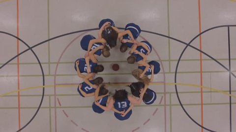 womens basketball team huddle up game plan aerial 4k
