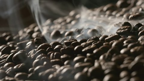 Roasted coffee beans with a smoke