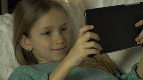 4K Child Playing Tablet PC on Sofa, Girl Portrait, Internet Searching in Night