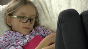 4K Sleeping Eyeglasses Child after Studying, Reading, Schoolgirl Napping on Sofa