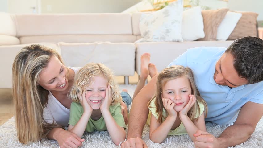 family lying in living room