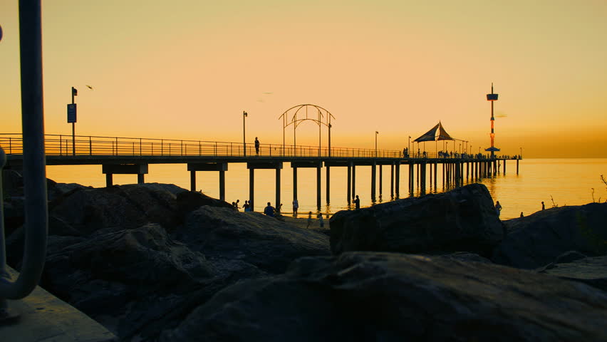 A motion camera timelapse of busy pier/jetty at sunset.