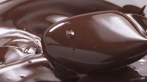 Slow motion of pouring melted premium dark chocolate, 180fps prores footage