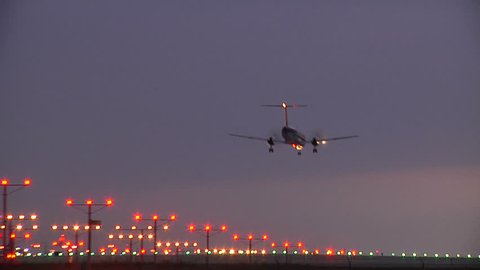 planes landing and taking off at sunset