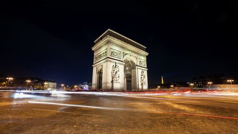 A timelapse at Arc de Triomph in Paris by night. This historical monument overlooks the avenue des champs élysées in the heart of French capital. The photos were taken in long exposure.