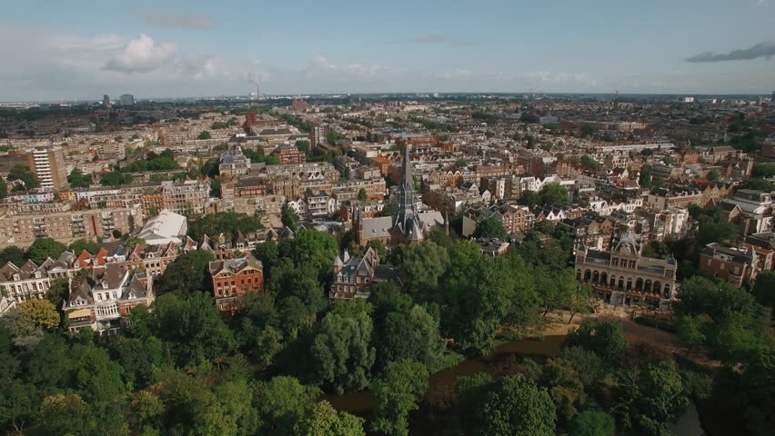 Aerial panorama of Amsterdam with houses, Vondelpark and Vondel Church. Dutch capital