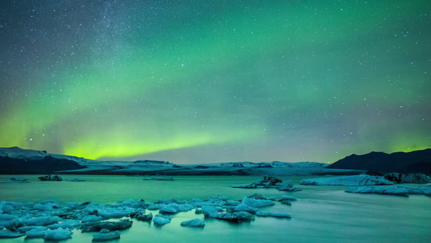 Amazing northern light aurora in glacier lake in Iceland - 4K