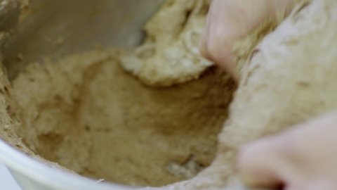 Women prepare the dough for macarons close-up view