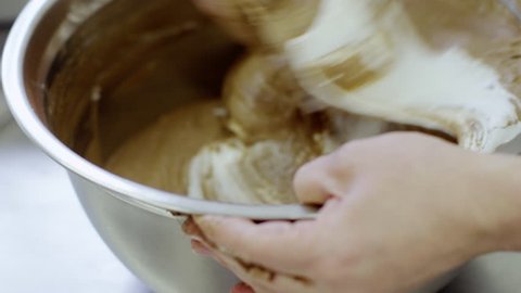 Women prepare the dough for macarons