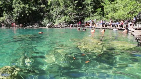 
CORON,PHILIPPINES-CIRCA  DECEMBER  2016  unidentified people swimming in a lake
