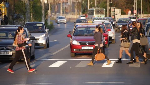 ROMANIA, BUCHAREST – APRIL 16 2016: Romanians learn early in the school to cross the street only through zebra and that’s reducing the number of accidents by large.