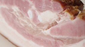 Tilting on smoked pork meat product layers close-up 4K 2160p 30fps UltraHD footage - Shallow DOF cured bacon tasty traditional food slow tilt 3840X2160 UHD video
