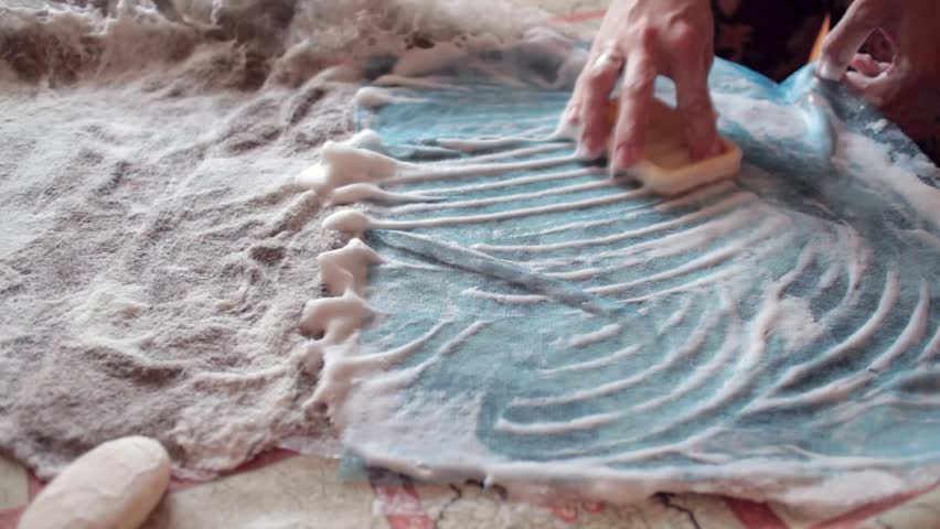 Women lathers procurement of wool during felting