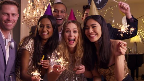 Group Of Friends Celebrating At New Year Party Together Stock Video