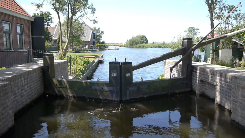 Old dam and canal in dutch landscape
