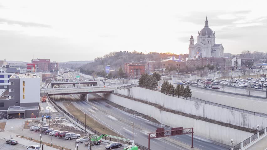 Highway Traffic and Dramatic Orange Sunset over the Cathedral of St Paul, Minnesota