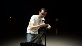 Videographer shoots the video using dslr camera, and slider