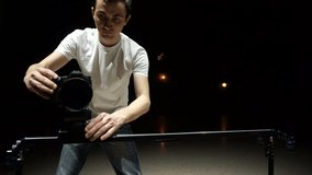 Cameraman shoots the video using dslr camera, and slider