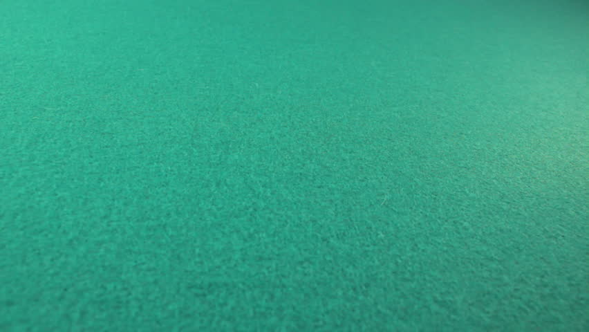 Red dice tumbling to camera on green felt casino table-multiple variations