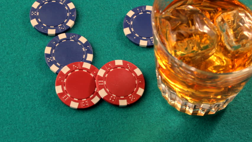 Poker chips fall next to glass of scotch on green casino table-4 variations
