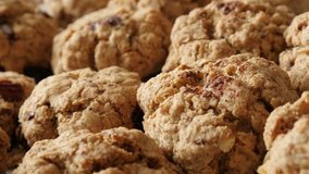 Chocolate chip cookies pile close-up shallow DOF 4K 2160p 30fps UHD panning footage - Homemade biscuits with oatmeal on plate slow pan 3840X2160 UltraHD video
