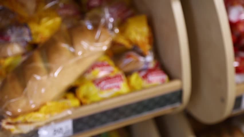 take bread and add to cart Royalty-Free Stock Footage #23992057