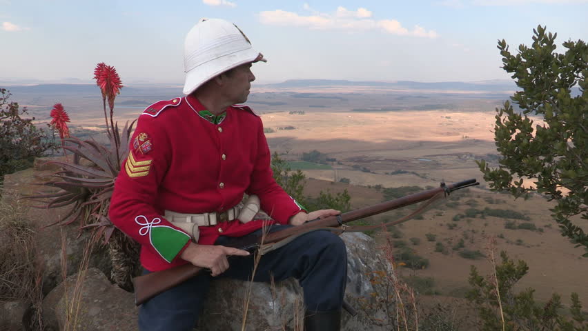 A  reenactment of a British soldier dressed up in the British redcoat military