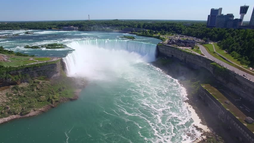 Niagara Falls aerial view, Maid of the Mist tourist boat in front of Horseshoe Falls on the border of US and Canada.