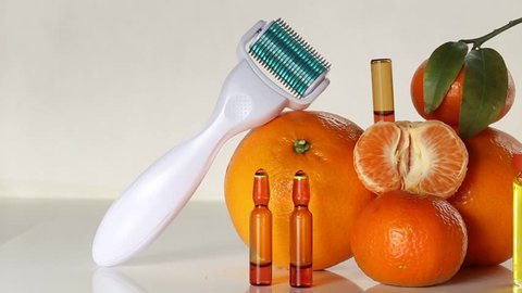 roller massage body and face and ampoules with vitamin C. Mesotherapy.