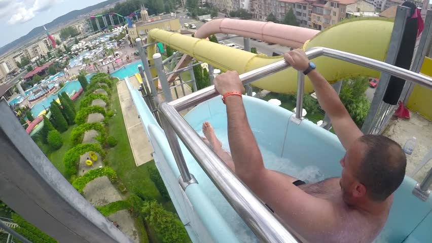 Man pulls off the extreme slide in the water park, SLOW MOTION