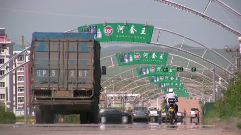 MANZHOULI - JULY 20 2008: Trucks are driving into a new city in Manzhouli, China