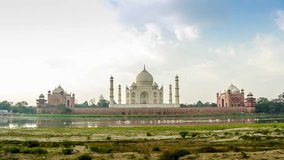 Time lapse video of an Amazing sunrise morning at Taj Mahal, India with large group of pelican Birds swimming in river