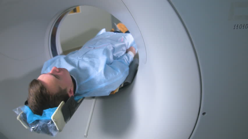 Patient is scanned by MRI, CT scanner. Magnetic resonance examination.
