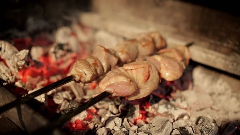 Appetizing skewers from quail fried on the coals