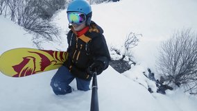 Footage of two snowboarders man and girl adventure at mountain backcountry. Walking to snowy alps mountains, Swiss. Snowboard and ski healthy activities, hiking. GoPro video