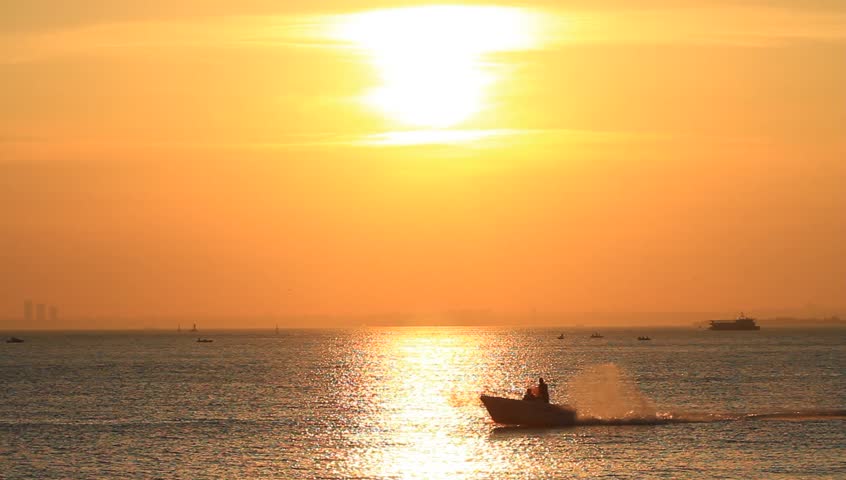 Power boat speeds up in Marmara sea on sunset. 