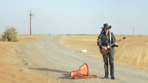 Guitarist on the desert road