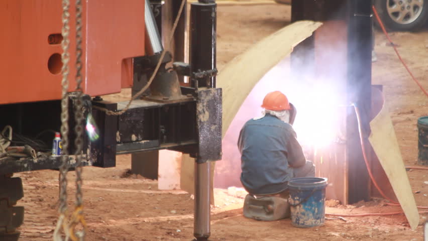 Welding - Steel beam welding at a construction site