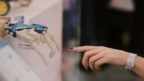 Touching hands of human and cyborg or The Creation of cyborg.