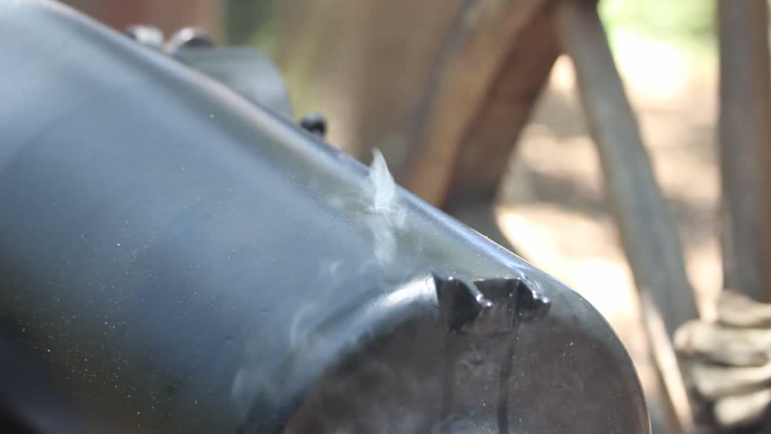 Smoke From Fuse Hole Of Muzzle Loading Cannon Rising