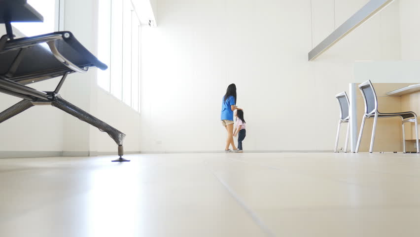 Asian baby and sister happy to play in the big room
