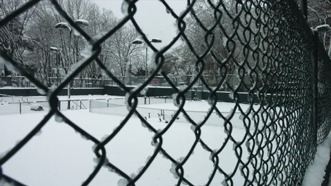 Tennis court covered with snow