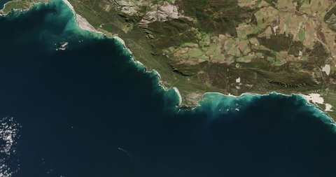 High-altitude overflight aerial of the southernmost portion of South Africa's Atlantic coast. Clip loops and is reversible. Elements of this image furnished by NASA
